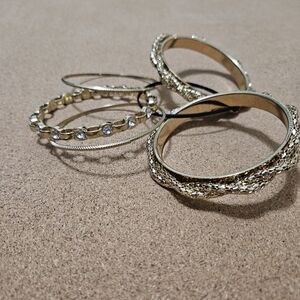 Gold colored bangles with rhinestones